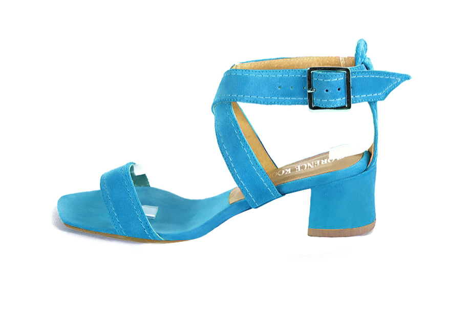 Women's turquoise blue elegant fully open cross straps sandals. Square toe. Low flare heels - Profile view